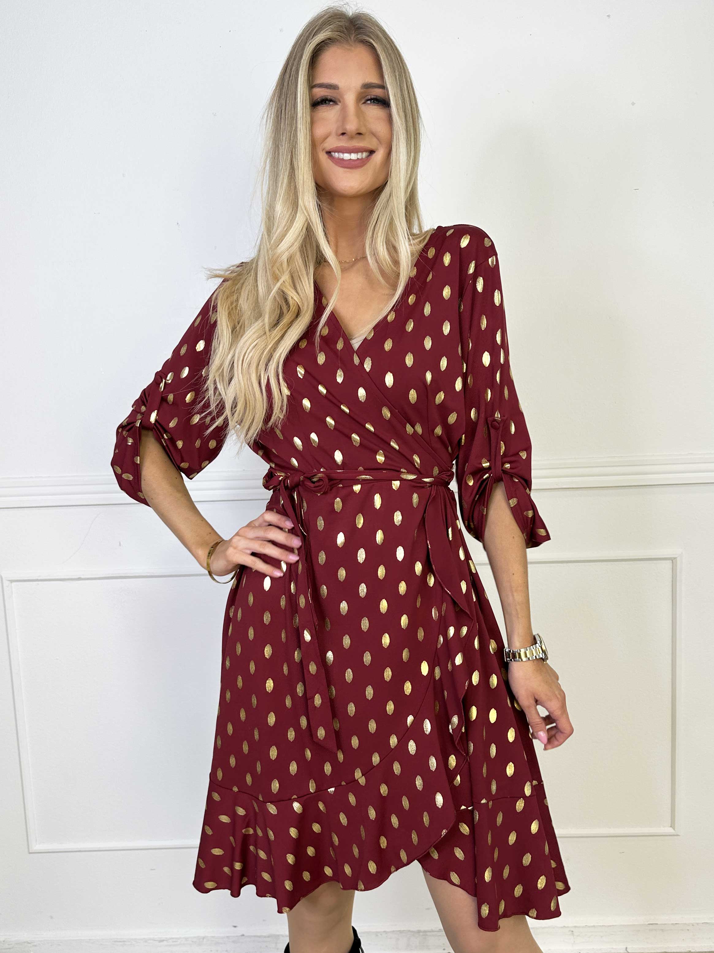 Savina Gold - Elastisk kjole i slå-om-look med guld dutter